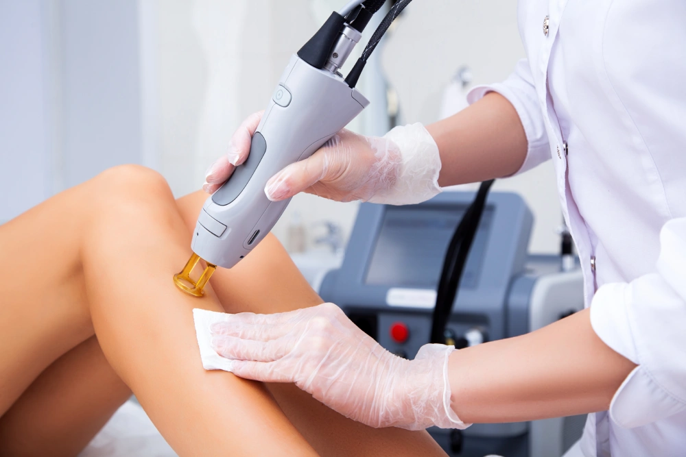 Esthetician using DiolazeXL for hair removal from legs | Fayced Aesthetics NYC | New York, NY