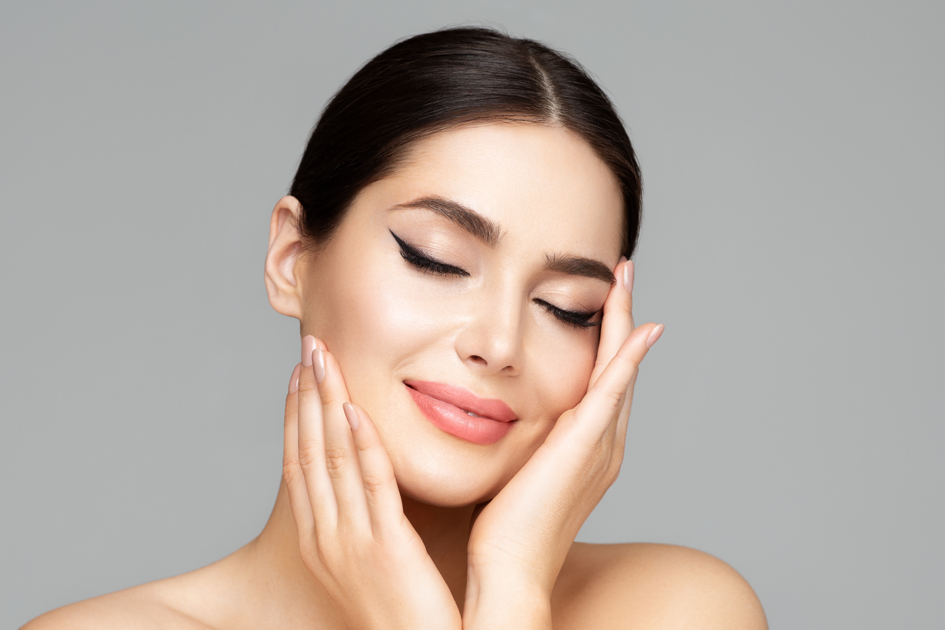 a woman with her eyes closed | Fayced Aesthetics NYC | New York, NY