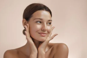 Woman with radiant, glowing skin after SkinVive treatment in New York City.